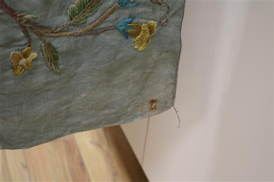 A crewel worked panel and another similar in green